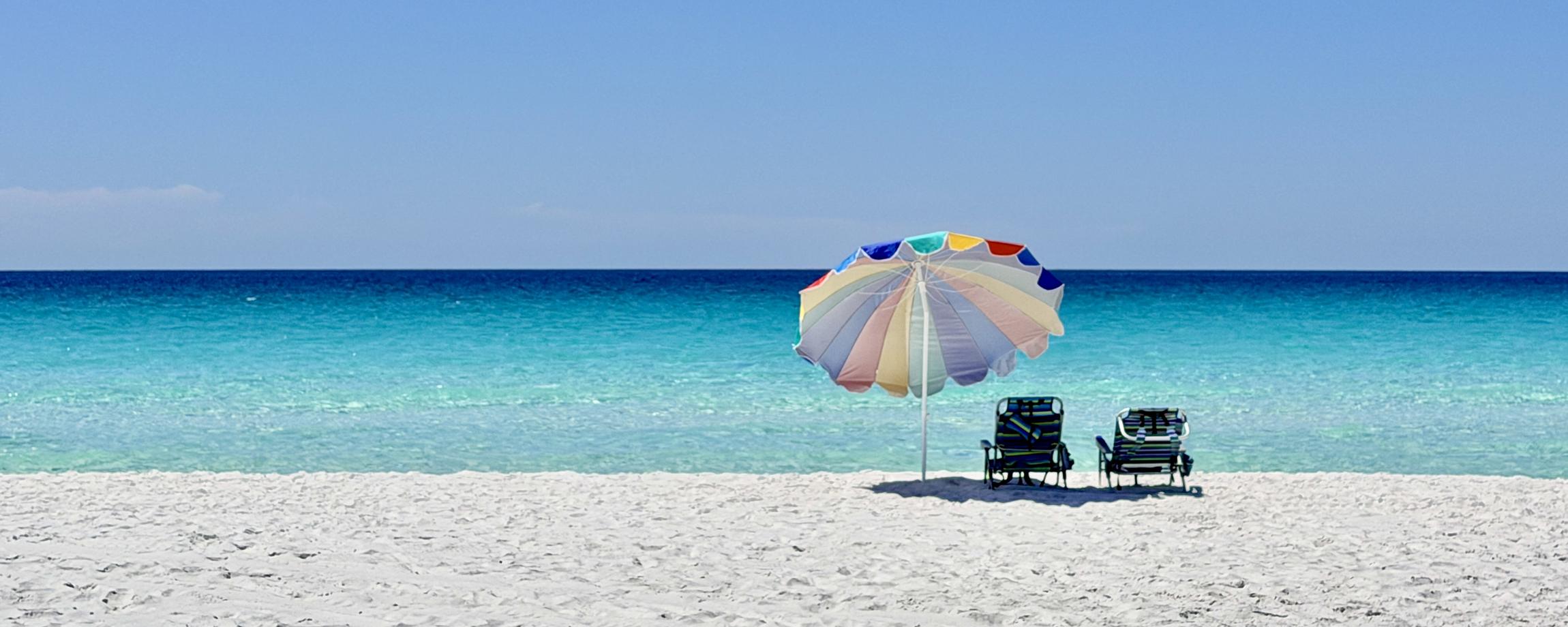 Beach umbrella and chairs on the white sand of the Gulf Coast at Destin, Florida